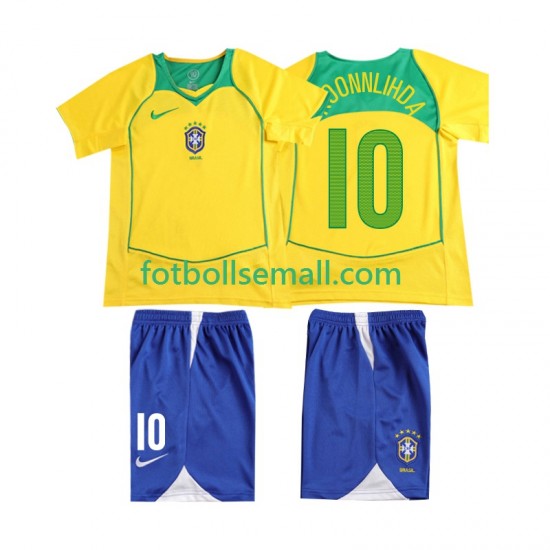 Matchtröjor Brasilien RONALOINHO 10 Retro 2004 Kortärmad till Barn (1:a ställ)